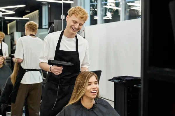 Stylists and clients engage in transformative hair styling, showcasing modern beauty trends. — Stock Photo