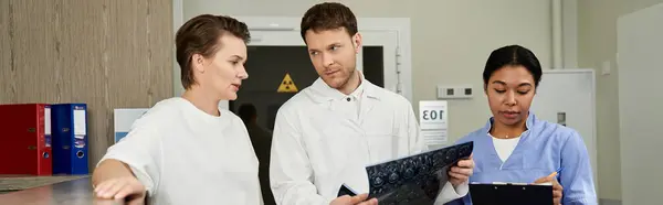 Healthcare professionals support patient after MRI procedure at a contemporary hospital, banner — Stockfoto