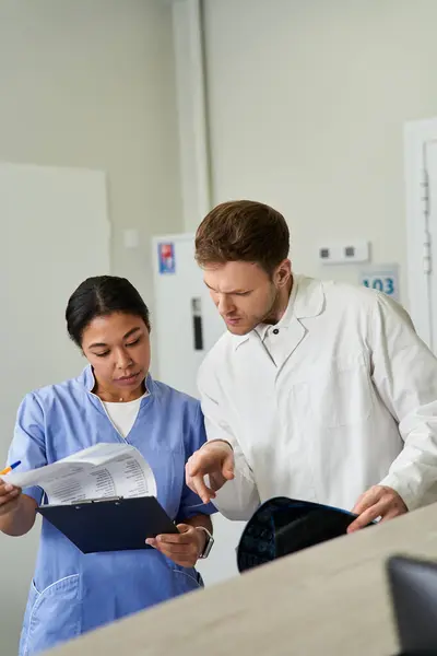 Two doctors reviewing results in a modern hospital focused on patient care. — Stockfoto