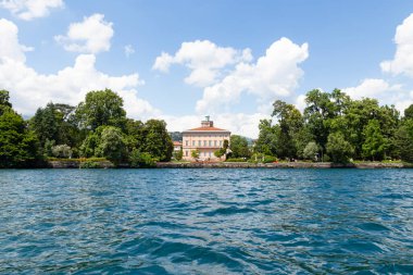 Switzerland, Lugano, 22. June 21. Lake waterfront with the villa and park ciani clipart