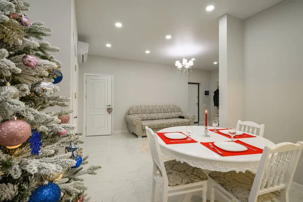 Interior of bright dinner room decorated with Christmas tree