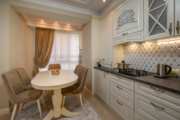 Stylish beige kitchen with a classic look, ample space, and top-quality appliances