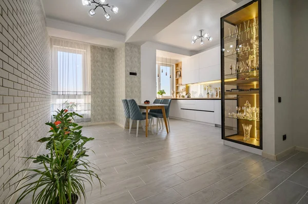 A contemporary white studio with a kitchen that has everything you need to prepare gourmet meals