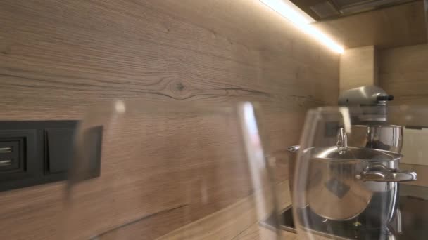 Closeup Slide Shot Worktop Wooden Kitchen Furniture Two Wineglasses Cooking — Vídeo de Stock