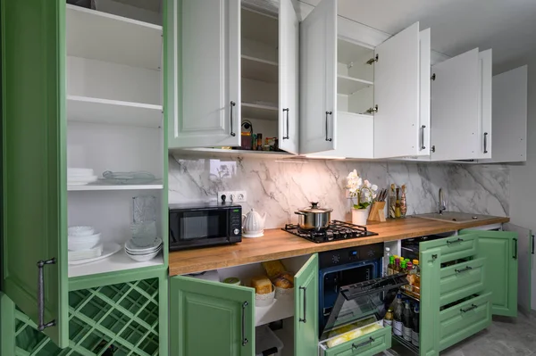 Doors Open Drawers Pulled Out New Green White Kitchen Furniture — Fotografia de Stock