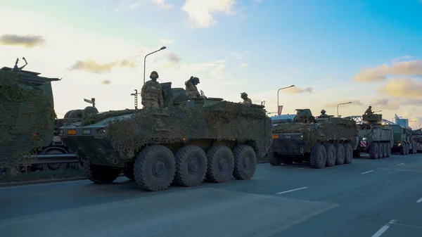 stock image November 18, 2022 NATO Tanks and Soldiers at Military Parade in Riga, Latvia. Military Army soldiers and Crowd With Latvian Flag.