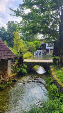 30 July 2024 Village of Rastoke Near Slunj in Croatia - Old Water Mills on Waterfalls of Korana River, Beautiful Countryside Landscape With River and Little Waterfalls in Rastoke Village, Croatia. clipart