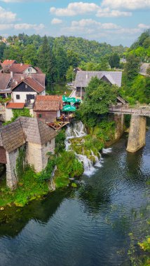 30 July 2024 Village of Rastoke Near Slunj in Croatia - Old Water Mills on Waterfalls of Korana River, Beautiful Countryside Landscape With River and Little Waterfalls in Rastoke Village, Croatia. clipart