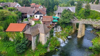 30 July 2024 Village of Rastoke Near Slunj in Croatia - Old Water Mills on Waterfalls of Korana River, Beautiful Countryside Landscape With River and Little Waterfalls in Rastoke Village, Croatia. clipart