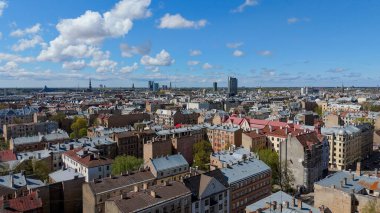 Aerial Drone View Of Riga Panorama In Latvia On A Sunny Spring Day Showcasing The Rooftops Of Houses The Vibrant City Center Historic Buildings And Barona Street Playground of the Downtown Sports Area