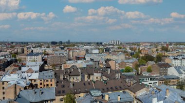 Aerial Drone View Of Riga Panorama In Latvia On A Sunny Spring Day Showcasing The Rooftops Of Houses The Vibrant City Center Historic Buildings And Barona Street Playground of the Downtown Sports Area