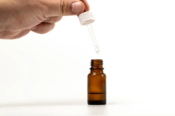Closeup Photo Person Dispensing Medical Drops Vertically Dripping Brown Bottle — Stock Photo, Image