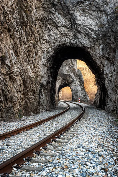 stock image Old railway passing through short tunnels in picturesque rural scenery