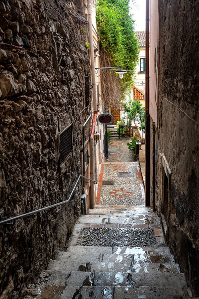 A characteristic narrow alley of Taormina, Sicily, Italy