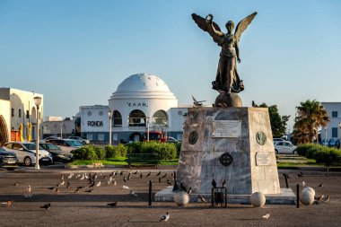 Rhodes, Greece. July 3, 2024: Angel statue of victory in Mandraki harbor in Rodos Town. clipart