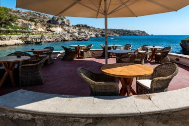 Coastal cafe with a bay view. Therms of the Kallithea Springs in Rhodes, Greece clipart