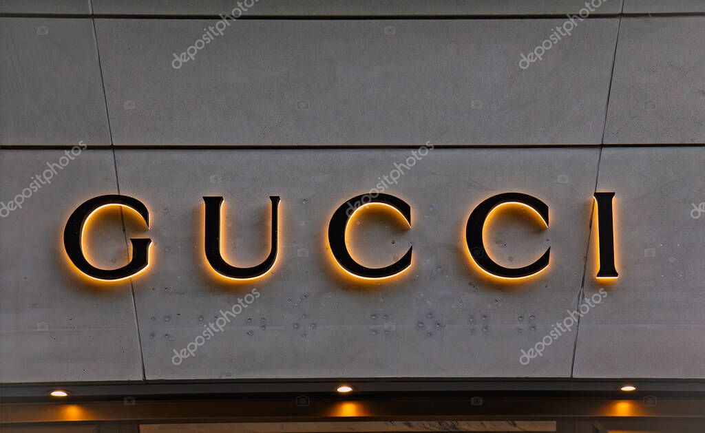 ZURICH, SWITZERLAND - AUGUST 3, 2022: Logotype logo sign of Gucci is an Italian luxury brand of fashion and leather goods, part of the Gucci Group, which is owned by the French holding company Kering