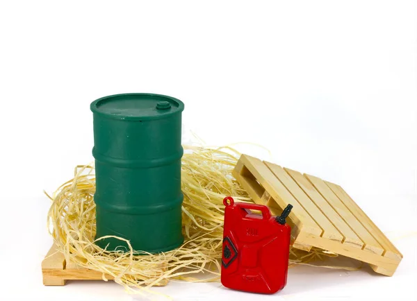Oil barrel and red oil can on white background