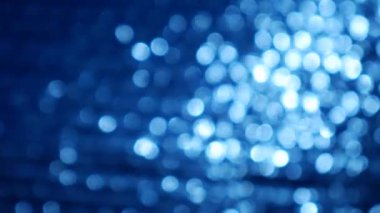 Mavi soyut ışıklar bokeh arka plan döngü.