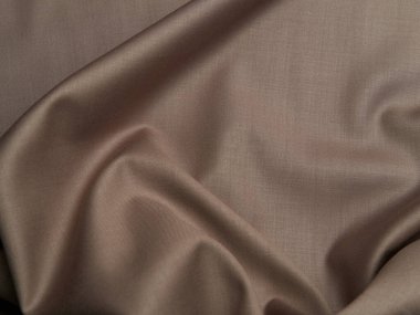 Beautiful folds of beige fabric. High-quality texture of beige fabric. clipart