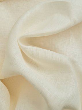 Güzel bej kumaş kıvrımları. Bej kumaşın yüksek kaliteli dokusu.