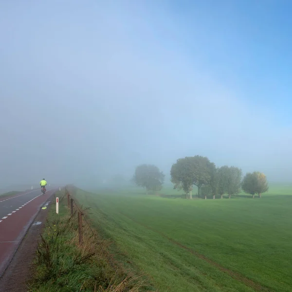 Lonely Man Bike Rides Mist Dike River Rhine Netherlands Foggy — Stock Photo, Image