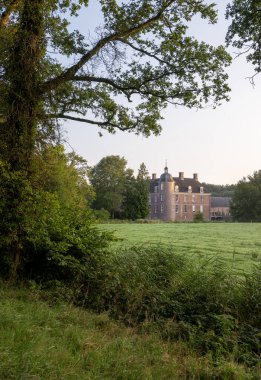 old manor slangenburg near dutch town of doetinchem and surrounding green landscape clipart