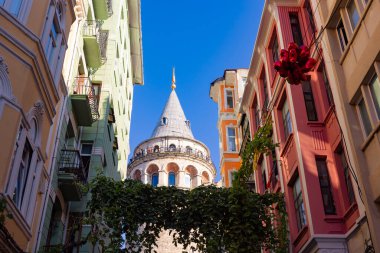 Galata Tower at daytime. Galata Tower view from street. Travel to Istanbul background photo. clipart