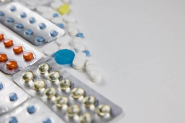 Pills or medicines background photo. Tablets and pills in the plastic blisters. Healthcare or medical concept photo with copy space.