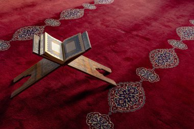 Islamic background photo. The Holy Quran on the lectern in the mosque. Ramadan or kandil or laylat al-qadr concept photo. Istanbul Turkiye - 1.18.2023