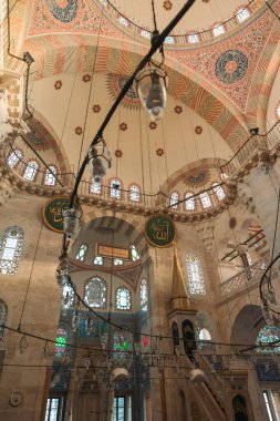 Islamic vertical photo. Interior of Kilic Ali Pasa Mosque. Islamic calligraphies on the walls. Ottoman architecture. Istanbul Turkiye - 12.24.2022