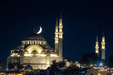 Ramadan or islamic photo. Suleymaniye Mosque and crescent moon. Kandil or laylat al-qadr or islamic or kadir gecesi concept background. Selective focus.