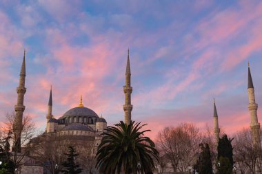 Blue Mosque or Sultanahmet Mosque at sunrise with pink and orange clouds. Ramadan or islamic background photo. Kadir Gecesi or Laylat al-qadr concept photo.
