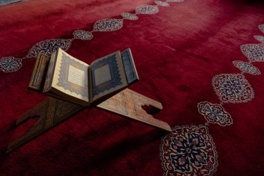 Islamic photo. Holy Quran on the lectern. Ramadan concept photo. Kadir gecesi or laylat al-qadr background photo with copy space. Istanbul Turkiye - 1.18.2023