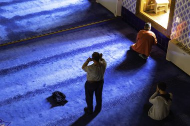 Ramadan or islamic background photo. Muslim men praying in the mosque. Ankara Turkiye - 5.16.2022