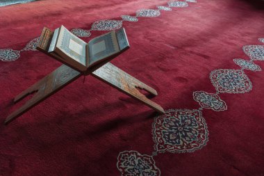 The Holy Quran on the lectern. Islamic or ramadan background photo with copy space for text. Istanbul Turkiye - 1.18.2023