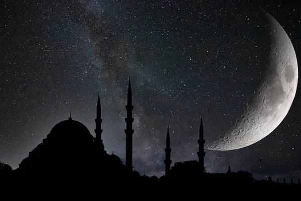 stock image Islamic or ramadan concept photo. Silhouette of Suleymaniye Mosque and crescent moon with milkyway.