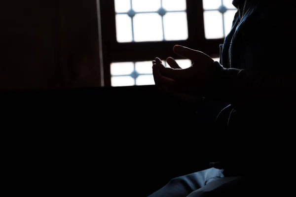 Stock image Muslim man praying in the mosque. Ramadan or islamic concept photo. Silhouette of hands.