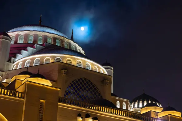 Islamic or ramadan background photo. Full moon and Buyuk Camlica Mosque. Ramadan kareem or eid mubarak or laylat al-qadr or kadir gecesi concept photo.