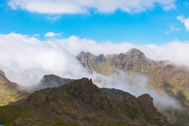 Landscape of the mountain range and rolling clouds over the peaks. Kackar mountain range in Black Sea region of Turkey. clipart