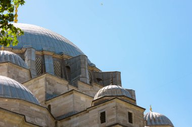 Architectural details of Suleymaniye Mosque with clear sky. Mosques of Istanbul background photo. clipart