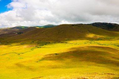 Landscape of a highland with shadows of the clouds. Persembe Plateau aka Persembe Yaylasi in Ordu Turkey. clipart