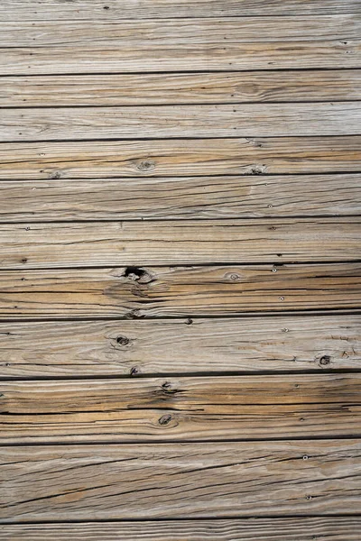 stock image Destin, Florida- Horizontal rough wood planks flooring. Close-up view of a wooden timber planks horizontally aligned flooring from above.