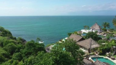 Aerial view of a hotel on the sea coast in Bali. High quality 4k footage