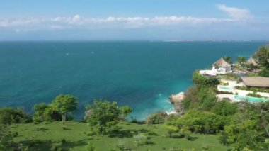 Aerial view of a hotel on the sea coast in Bali. High quality 4k footage