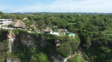 Aerial view of a hotel on the sea coast in Bali. High quality 4k footage