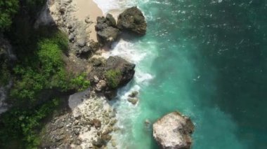 The coast of the sea with drone, rocks, sand and waves of the sea. High quality 4k footage