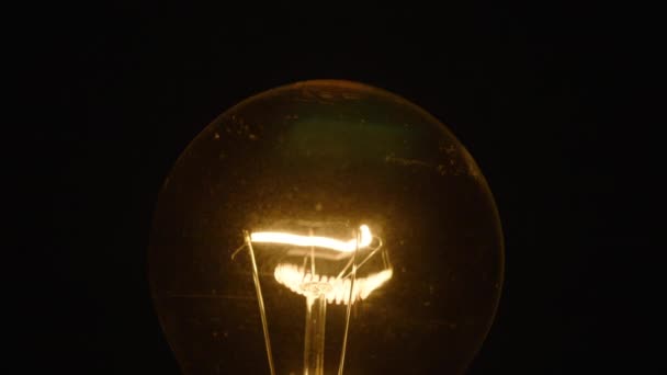 Tungsten Light Bulb Light Turns Cozy Black Background Close Shot — Stock Video