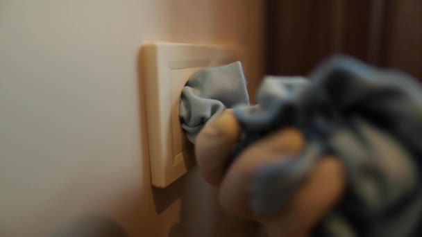 Cleaner Hand Carefully Wipes Blue Cloth Electric Socket White Wall — Stock Video