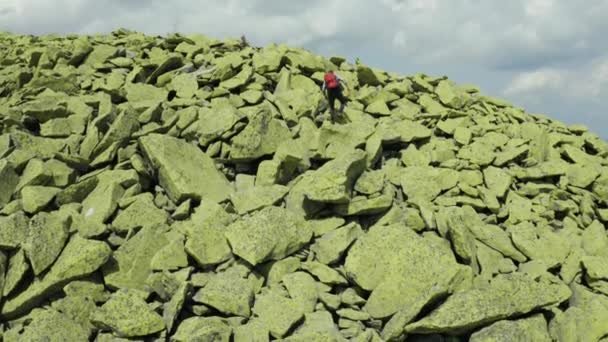 Man Walks Mountain Slope Covered Giant Stones Solo Tourism Hard — Stock Video